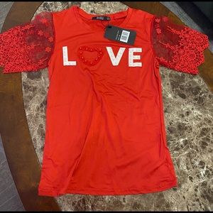 Beautiful red blouse with LOVE! Brand new.